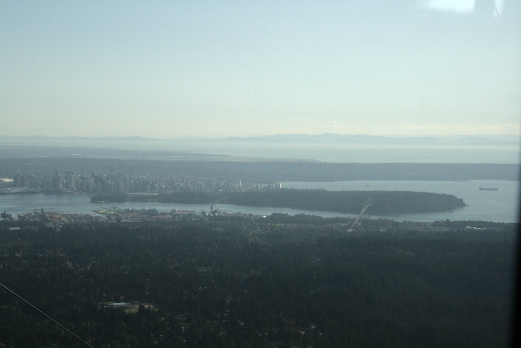 View going down the grouse mountain gondola. In the distance (from far to near): Vancouver Island, Georgia Strait, UBC, Downtown, Stanley Park, Burrard Inlet and North Van.