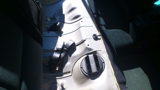 under rear seat before