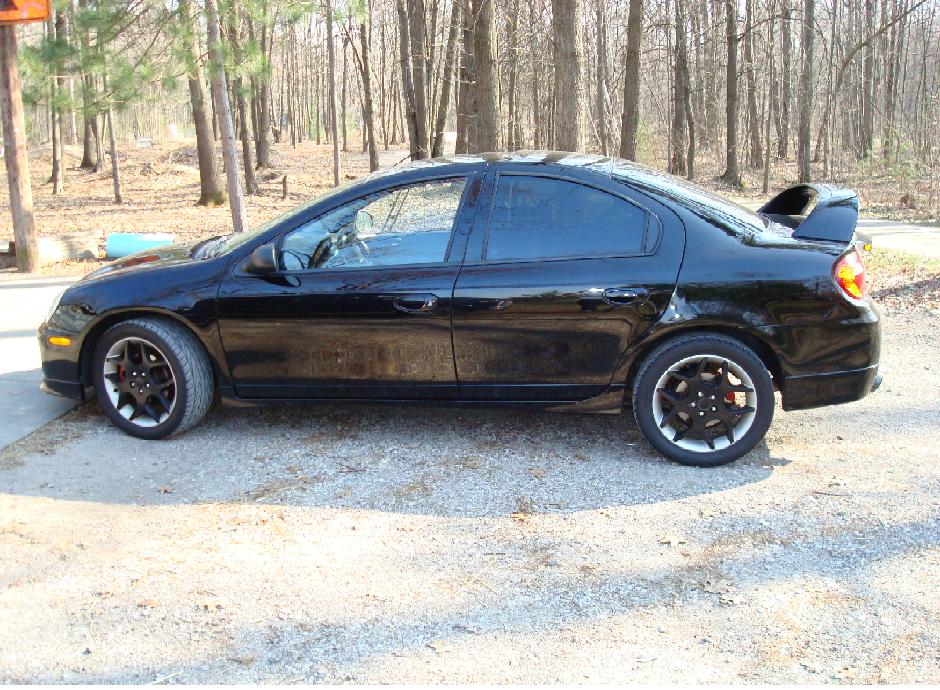 Stock rims painted black. Doesn't look too bad, but it is coming off around the lug nuts.