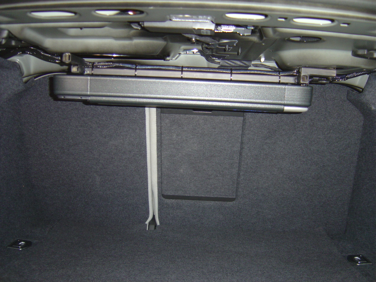 Audison lrx5 channel under the rear deck, cover is off until I am done tuning. welded the rack for it, since MDF is weak for a car...