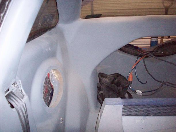Whole car is fiber glassed but this is built in custom 6*9 in the rear seat area.