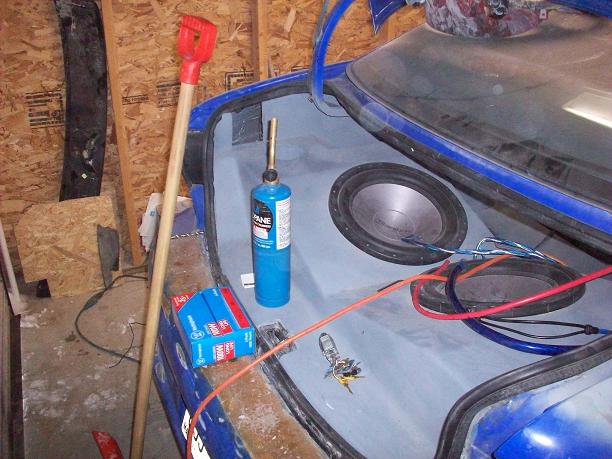The old sub set up. The elites are to tall so i had to cut it all out. Built a new box in and almost done fiberglassing it again.
