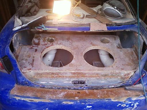 This is what the NEW truck area looks like fiberglasses in just gotta smooth it out and i hope to primer the hole inside of the car by the end of the 1st wk in april this yr! lol