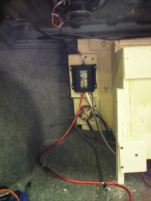 power fuse block and ground dist block<br />you can also see the RSD65coax up top.<br /><br />Also note the bolts holding the sub box to the frame we constructed.  even though i added legs as a long term precaution, the box doesn't actually need to touch the floor.