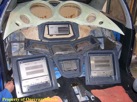 Inside of the car, where the back seat used to be w/the motorized TiDD10 in the stow position.