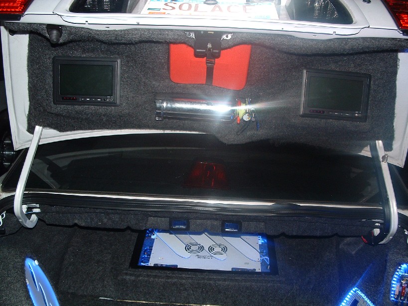 Tvs in the trunk lid and fire extinguisher and 1st aid kit just in case.