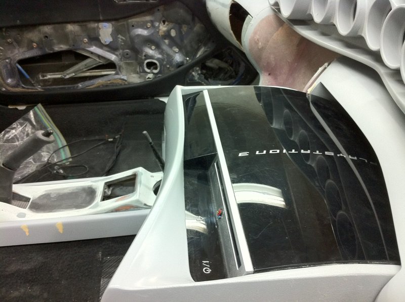 A motorize PS3 that comes out of the dash.