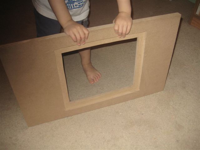 I cut the wood to size, cut out the window and routered out the perimeter for the lexan to lay into once complete time for carpeting..