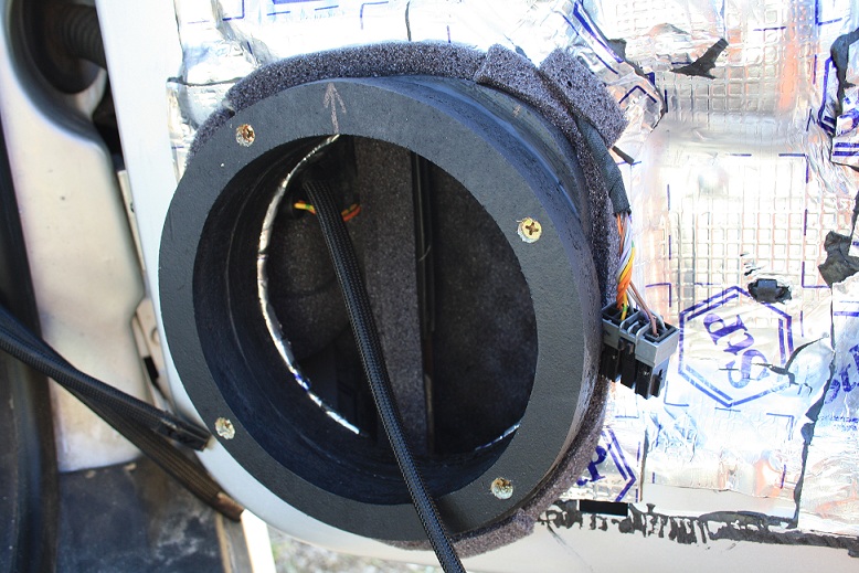 behind the speakers wavy foam mat.