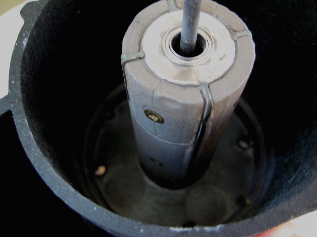 the cleaned magnet; at one point you have to decide that it's clean enough; if you keep on brushing, you will keep on loosening magnetic material.