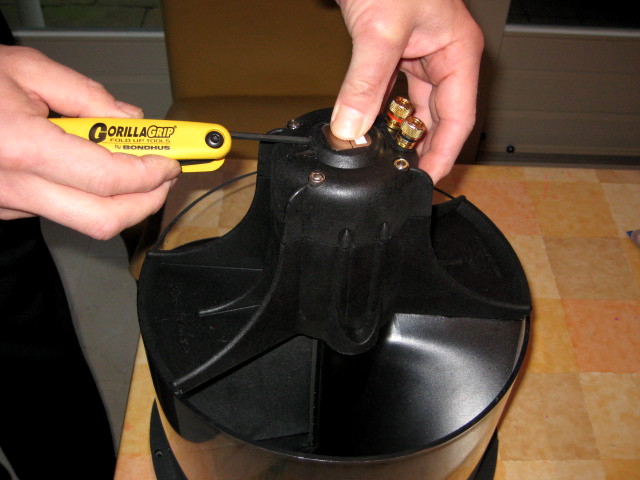 pressing down the clamps while evenly tightening the halves.