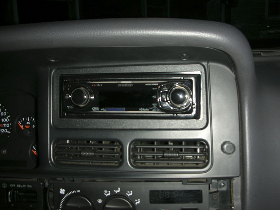 first shot of the unit installed.  its sitting pretty crooked and I used the kenwood trim in this pic, and didn't like how it fit or looked.  left too much space all around,  looked cheesy.