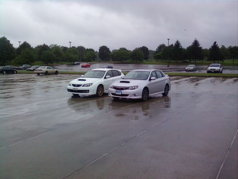 Cool pic of my Rex and my Buddy's STi on a rainy day.